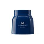 1.1lb blue jar of Manuka honey on a white background.