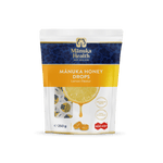 Manuka Health Manuka Honey Drops Lemon Flavor packaging on a green background