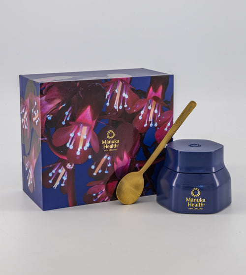 Manuka Health Manuka Honey MGO Kit jar with a gold spoon and packaging on a white background.
