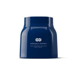1.1lb blue jar of Manuka honey on a white background.