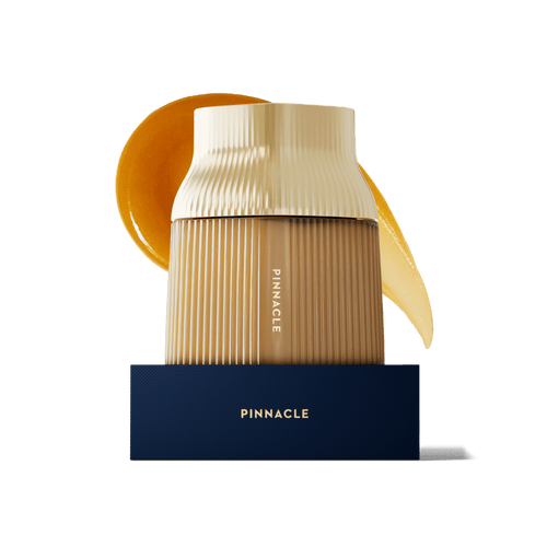 Pinnacle MGO 1600+ glass Manuka Honey jar with a gold cap.